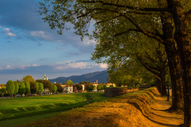 Travelling in Tuscany. The Walls of Lucca public park with the eastern district of Arancio