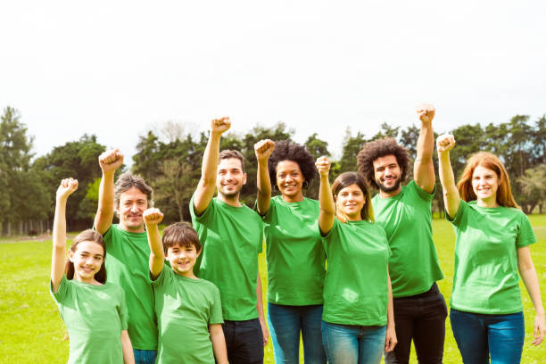 istock Volunteers with hand raised gesturing fists 1351454057