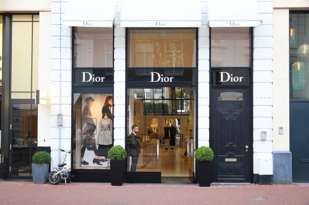 Tokyo, Japan - May 27, 2023 : Pedestrians walk past the Christian Dior's shop at the Ginza shopping district in Tokyo, Japan.