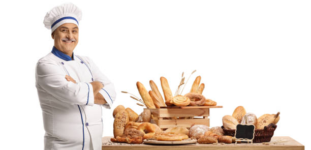 istock Mature male chef baker posing in front of a table with different breads 1351459831