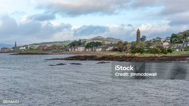 The Town Of Largs Set On The Firth Of Clyde On The West Coast Of Scotland Looking From The Marina Into The Town Past The Pencil Monument On A Cold Day Stock Photo - Download Image Now