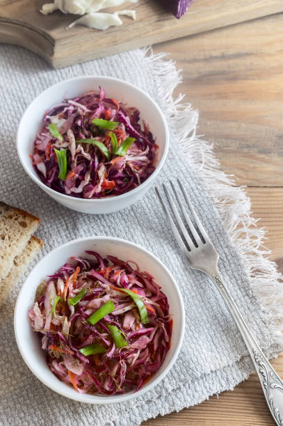 istock Coleslaw salad with fresh cabbage and green onions. 1351465614