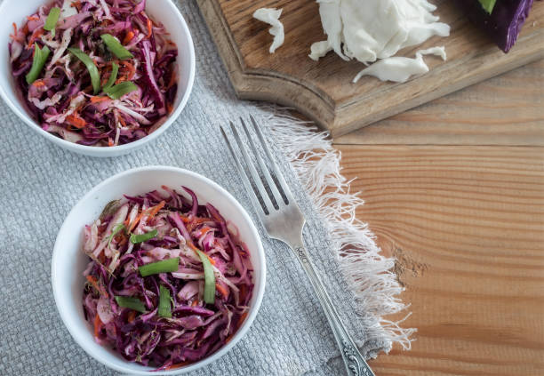 istock Coleslaw salad with fresh cabbage and green onions. 1351465616
