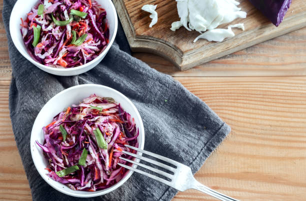 istock Coleslaw salad with fresh cabbage and green onions. 1351465621