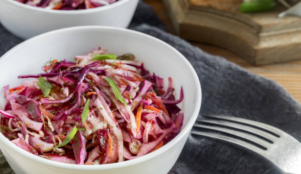 istock Coleslaw salad with fresh cabbage and green onions. 1351465627