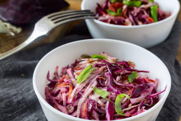 istock Coleslaw salad with fresh cabbage and green onions. 1351465632