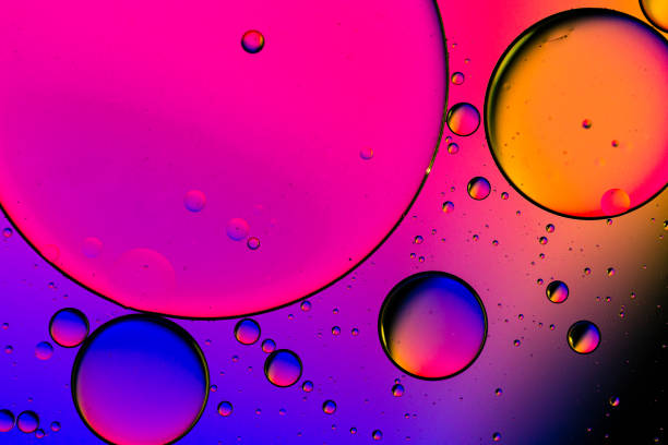 macro huile et eau fond abstrait multicolore - science photos et images de collection