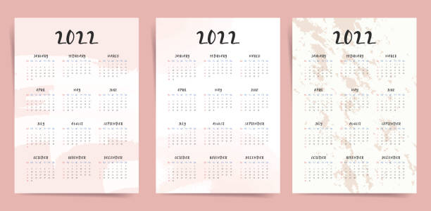 One page wall fashion elegant calendar 2022 set. 2022 new year calendar with watercolor abstract background in pink and beige colors. One page wall fashion elegant calendar 2022 set. 2022 new year calendar with watercolor abstract background in pink and beige colors. Aesthetic A3 A4 calendar template. 日記 stock illustrations