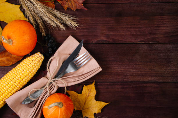 istock Thanksgiving cutlery setting. Festive table decor on wooden background. 1351467411
