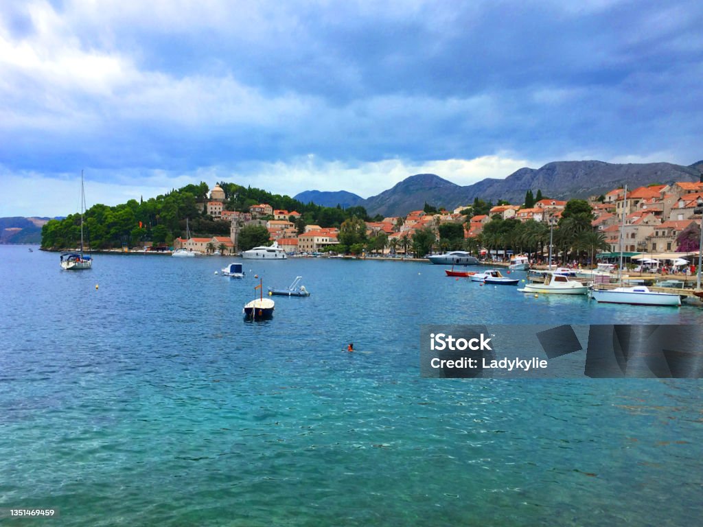 Harbour of Cavtat, Croatia. Harbour view of Cavtat, a small town near the famous travel destination  Dubrovnik in Croatia. A cloudy day but not yet raining, blue clean water. Cavtat Stock Photo