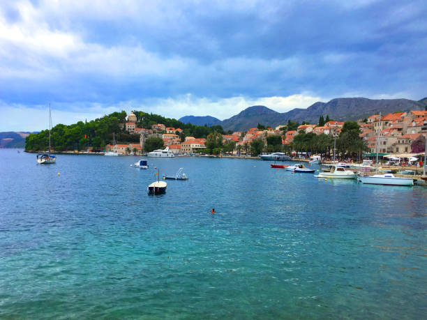 Harbour of Cavtat, Croatia. Harbour view of Cavtat, a small town near the famous travel destination  Dubrovnik in Croatia. A cloudy day but not yet raining, blue clean water. cavtat photos stock pictures, royalty-free photos & images