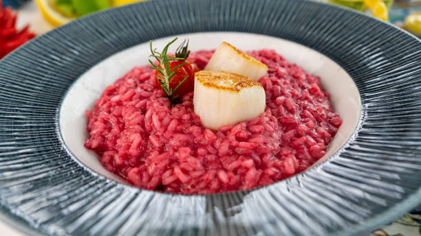 istock View of a beetroot risotto with scallops in a bowl 1351470522