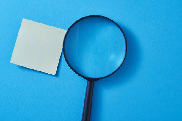 istock magnifying glass and message paper 1351471066