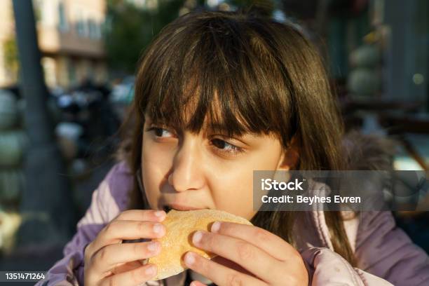 Beautiful Cute Little Caucasian Girl With Hamburger Stock Photo - Download Image Now