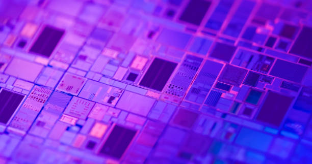 Macro of silicon wafer semiconductor Macro of silicon wafer semiconductor with neon color - integrated circuits to manufacture CPU and GPU transistor stock pictures, royalty-free photos & images