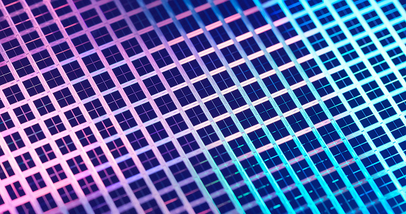 Macro of silicon wafer semiconductor with neon color - integrated circuits to manufacture CPU and GPU