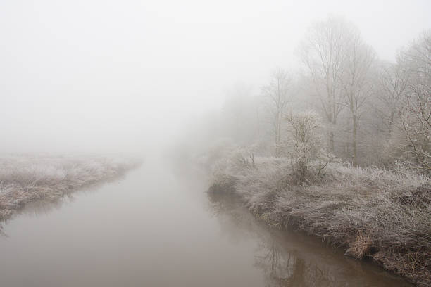 istock The fog-river disappearing into murky greyness. 135147516