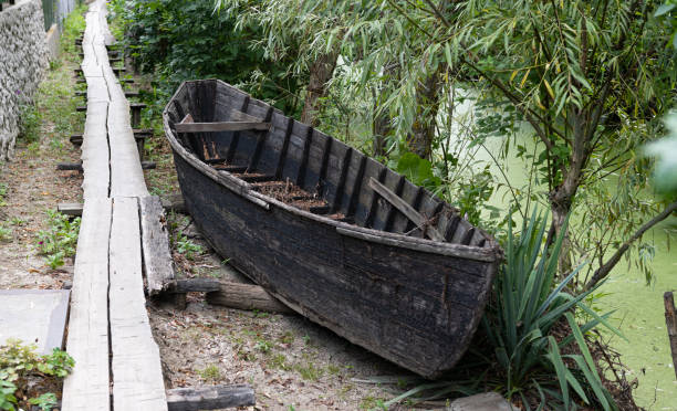 istock old wooden boat on the shore 1351476591