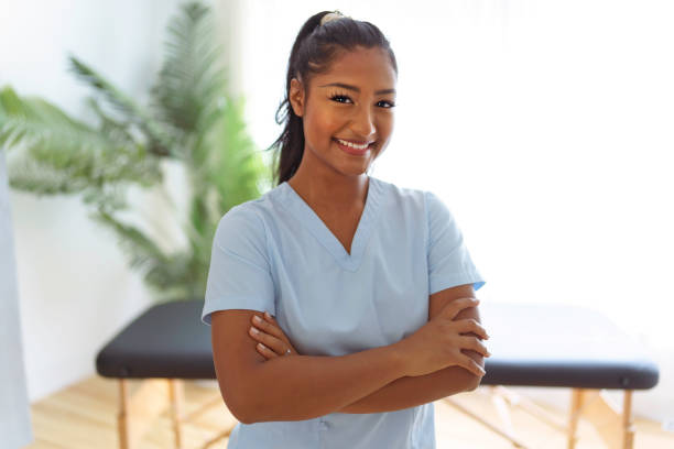 Portrait of young woman physiotherapist on a physio center stock photo