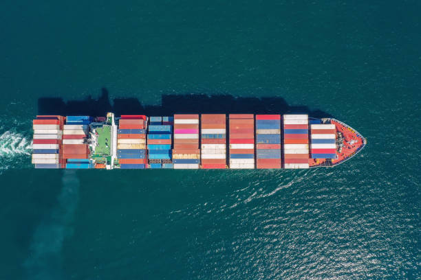 istock Aerial top view container ship full load container for logistics import export, shipping or transportation concept background. 1351477545