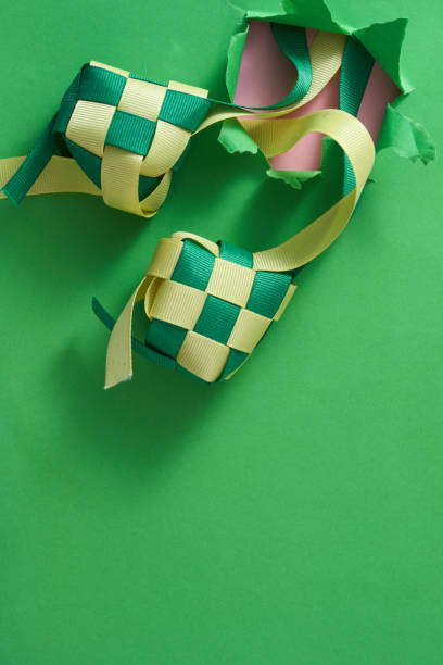 istock ribbon ketupat from the torn paper bullet hole 1351478054