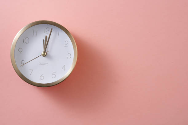 istock modern alarm clock on pink background 1351479024