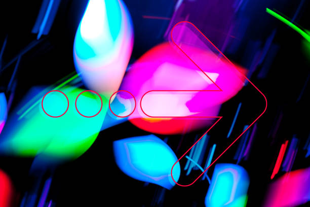istock Graphic Arrow on dark background with blurred multicoloued shapes. 1351480574