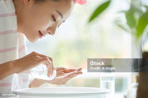 Young Asian Woman Washing Her Face Stock Photo - Download Image Now - Facial Cleanser, Moisturizer, Skin Care