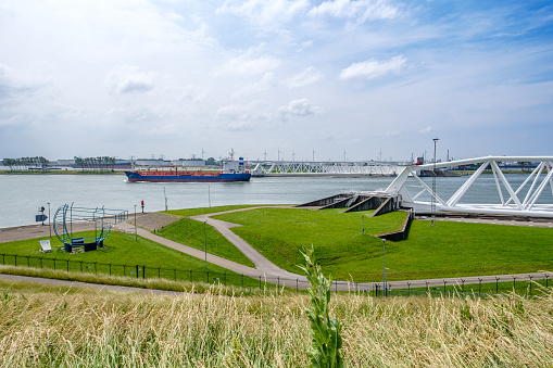 The Maeslantkering is a huge storm surge barrier on the Nieuwe Waterweg. This storm surge barrier is part of Delta Works and it closes if the city of Rotterdam is threatened by floods