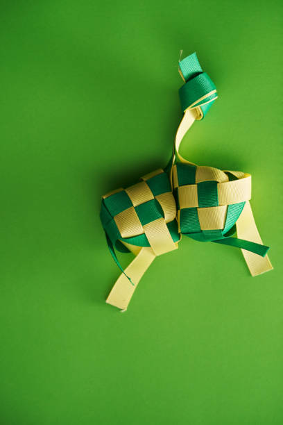 istock yellow and green ribbon ketupat 1351483136