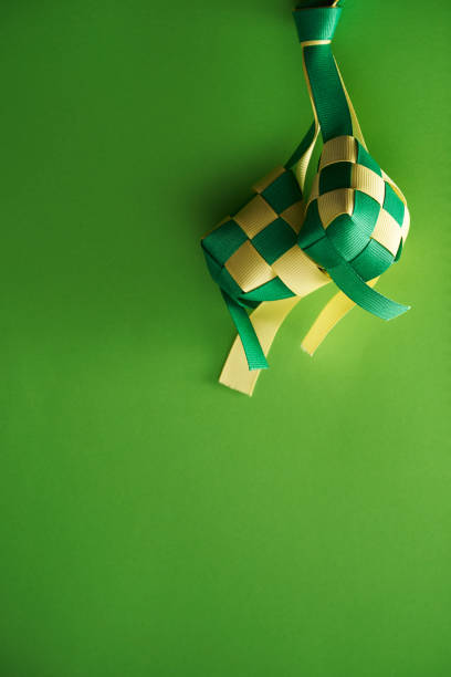 istock yellow and green ribbon ketupat 1351483148