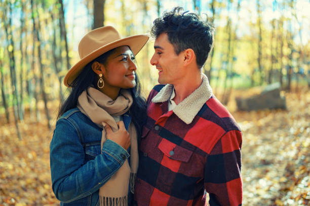 istock Young Couple in Autumn Forest 1351484319