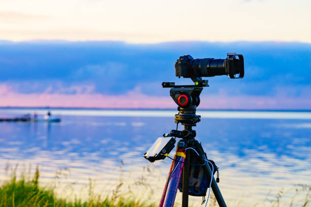 istock Camera taking picture of sea coast landscape 1351484501