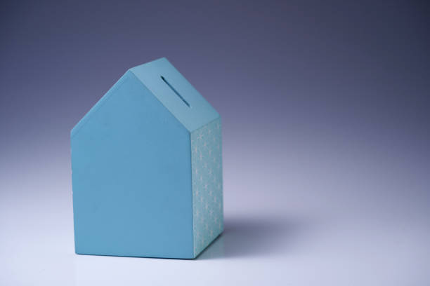 istock house shape coin box on gray background 1351485042