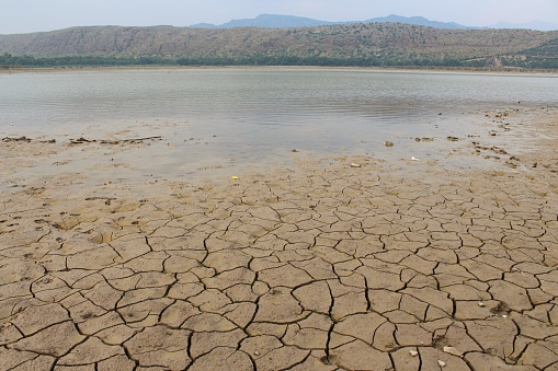 Dry and cracked land, dry due to lack of rain. Effects of climate change such as desertification and droughts.
