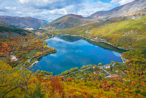 When nature is romantic: the heart - shaped lake on the Apennines mountains, in Abruzzo region, central Italy, during the autumn with foliage