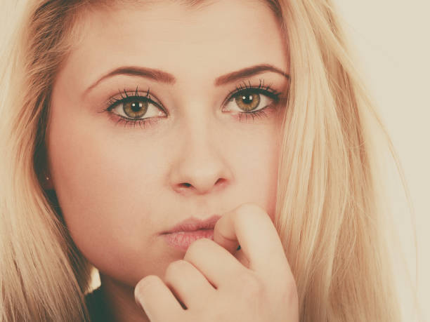 istock Attractive blonde woman thinking and contemplating 1351486471