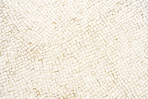 White mosaic tiled floor surface close-up