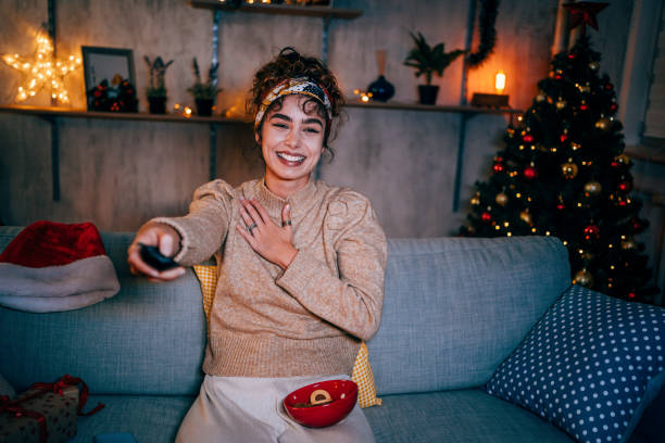 Woman watching tv at home