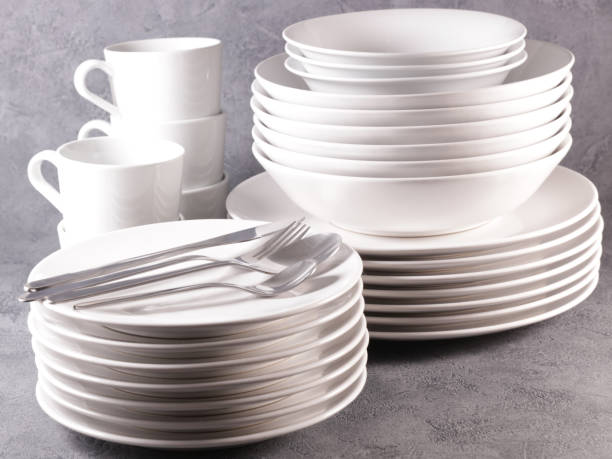 istock stack of empty and clean plate,  bowl and cutlery 1351490036