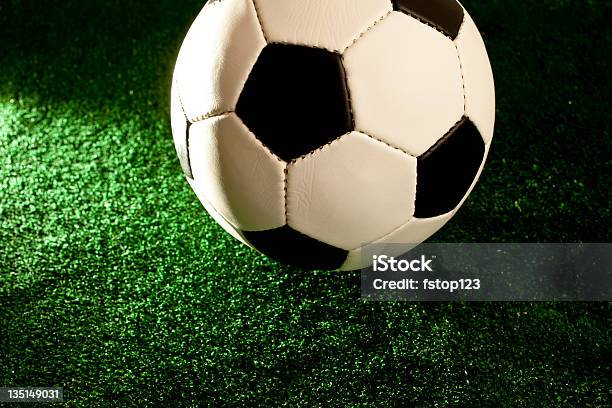 Soccerball Football On Green Grass Turf Foto de stock y más banco de imágenes de Actividades recreativas - Actividades recreativas, Aire libre, Artículos deportivos