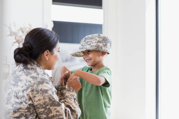 istock Female soldier tells her son goodbye before leaving for deployment 1351490481