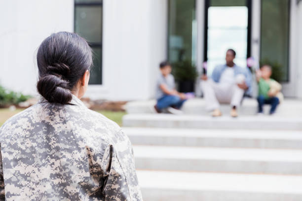 istock Woman returns home from military deployment 1351490493