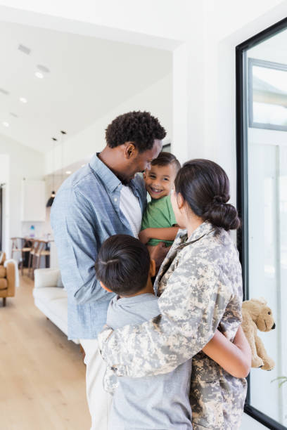 istock Family welcomes army soldier mom home from deployment 1351490676
