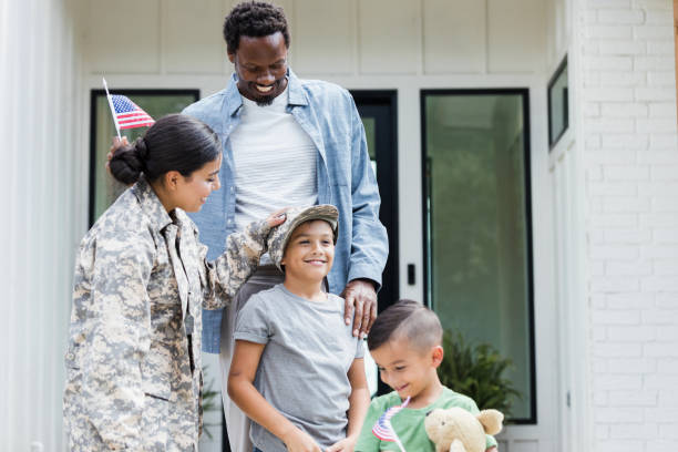 istock Family welcome military mom home from assignment 1351490687
