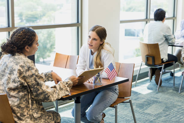 istock Military recruiter asks potential recruit questions about application 1351490982