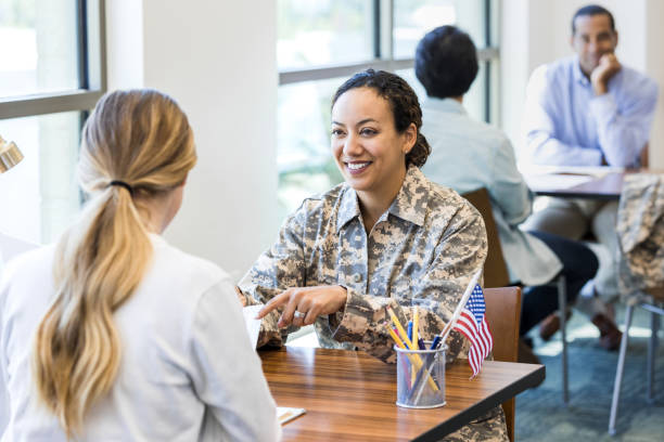 istock Smiling military recruiter talks with new recruit 1351490998