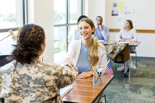 istock Military recruiter greets potential recruit 1351491000