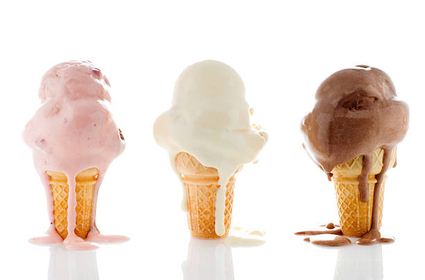 3 melting ice creams , 1 strawberry, 1 chocolate, 1 vanilla three melting ice cream cones melting stock pictures, royalty-free photos & images