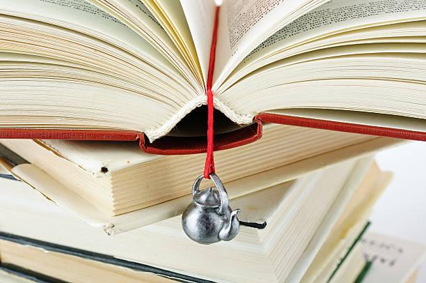 istock Stack of used books with a hand-made bookmark 135149979